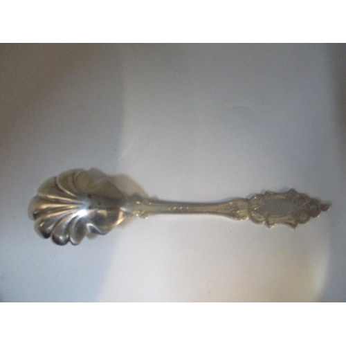 183 - A Victorian Exeter silver long handled caddy spoon or preserve spoon, with shell shaped bowl and eng... 