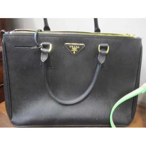 197 - Four modern ladies handbags in the style of well known fashion houses
Location: LAF