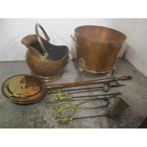 218 - A selection of fireside items to include a Victorian copper and brass coal basket, warming pan, fire... 