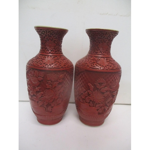 232 - Oriental collectables to include a pair of Chinese cinnabar vases on porcelain, decorated with panel... 