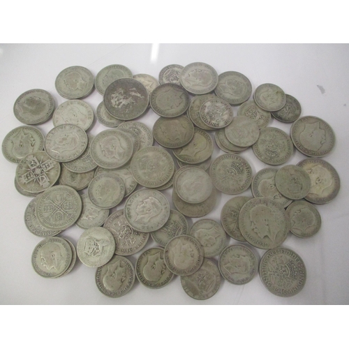 32 - A collection of pre 1947 silver coins to include four half crowns, thirty florins and one shilling, ... 