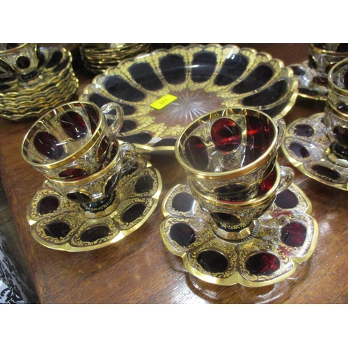 327 - A French overlaid and gilt dessert set together with matched Czechoslovakian overlaid and gilt cups ... 