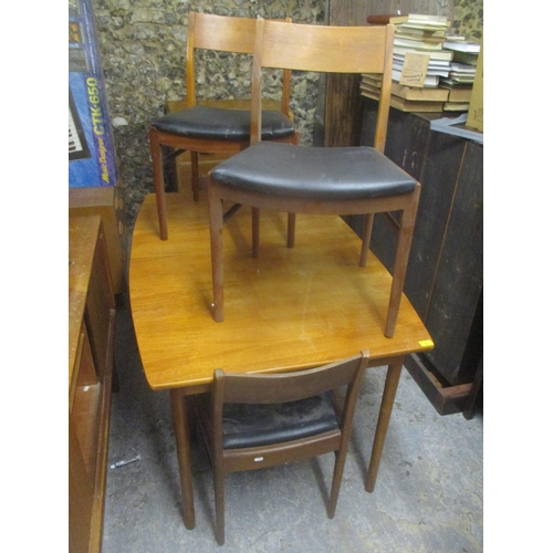 41 - A mid 20th century retro teak extending dining table together with four matching chairs, 74cm h x 13... 