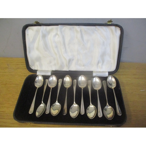 59 - A cased set of eleven early 20th century silver teaspoons 108.8g
Location: FSL