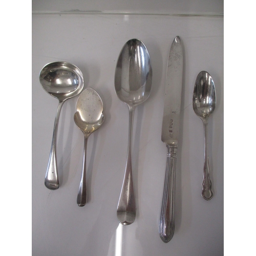 6 - Mixed 19th and 20th century silver to include a preserve spoon, a sauce ladle, a serving spoon and a... 