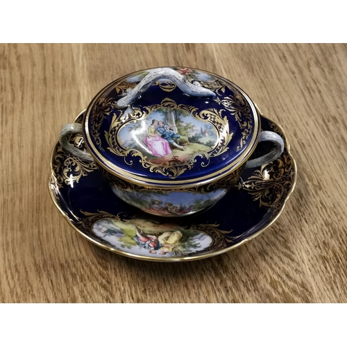 74 - A 19th century Meissen lidded soup bowl and saucer, hand painted with classical romantic scenes on a... 