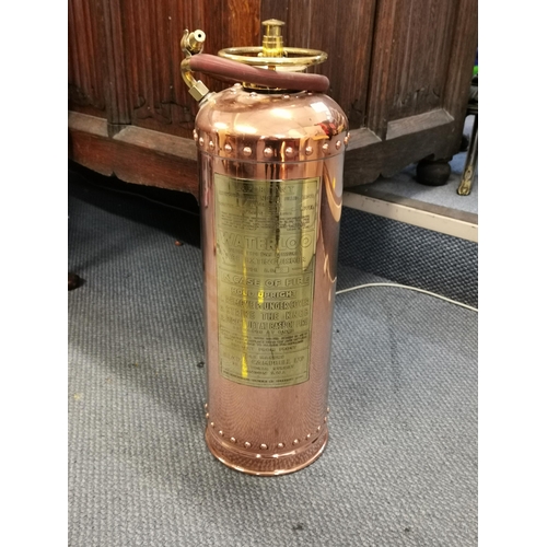 83 - A vintage 'Waterloo' copper fire extinguisher by Read and Campbell, 58cm high
Location: RWM