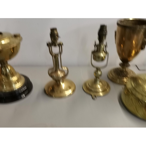 86 - Brassware to include two carriage table lamps, two oil lamp bases, an Art Nouveau ink stand, lidded ... 