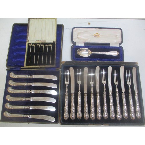 179 - A selection of cased silver flatware to include a christening spoon, set of six cocktail sticks with... 