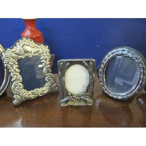 321 - A group of silver photograph frames to include a Keyford Frames Ltd Art Nouveau style frame, four Ri... 