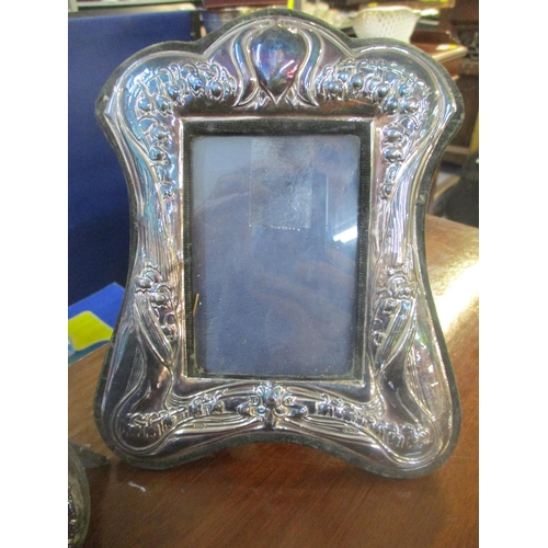 321 - A group of silver photograph frames to include a Keyford Frames Ltd Art Nouveau style frame, four Ri... 