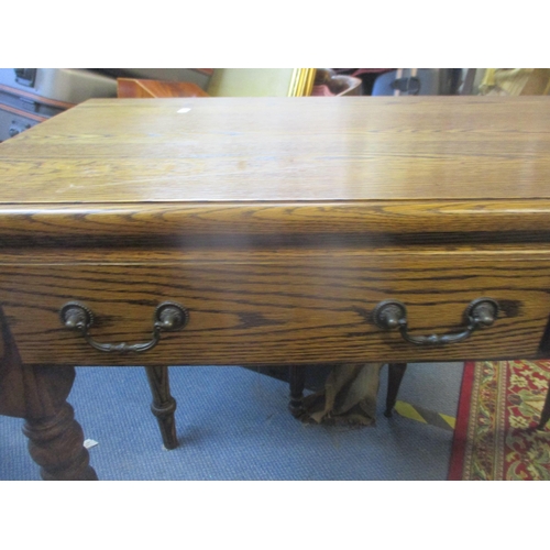 79 - A good quality oak side table with two short drawers on ring turned, vase shaped legs, 79 h x 70 w x... 