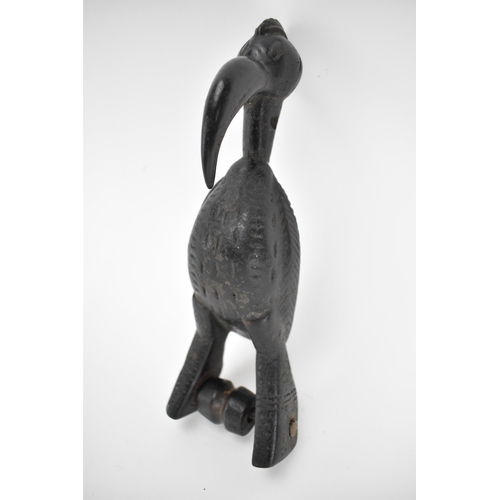 66 - A 19th/20th century Senufo wooden weaving heddle pulley, Ivory Coast, carved as a hornbill bird, a b... 