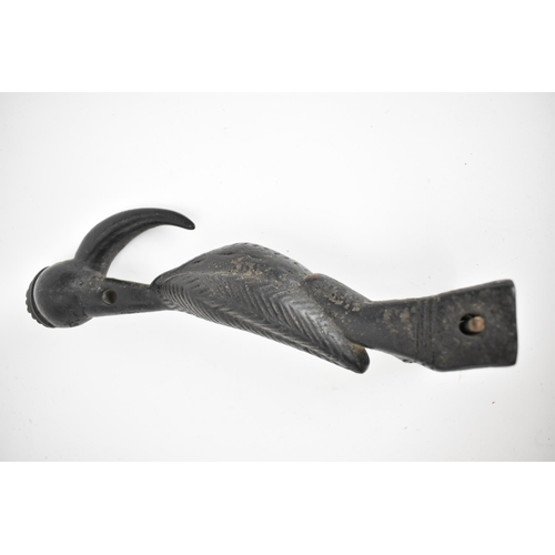 66 - A 19th/20th century Senufo wooden weaving heddle pulley, Ivory Coast, carved as a hornbill bird, a b... 