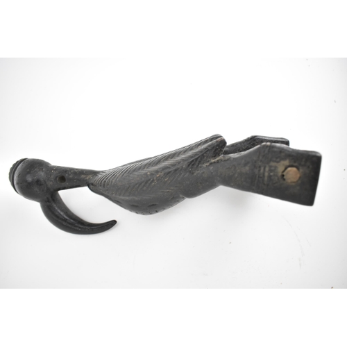 66 - A 19th/20th century Senufo wooden weaving heddle pulley, Ivory Coast, carved as a hornbill bird, a b... 