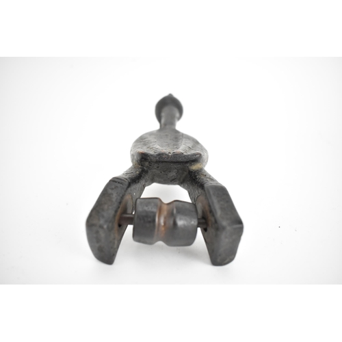 66 - A 19th/20th century Senufo wooden weaving heddle pulley, Ivory Coast, carved as a hornbill bird, a b... 