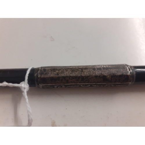 79 - A Late 19th/early 20th Century ebony conductor's baton with Sterling silver worked handle, tip and c... 