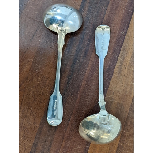 156 - Two Victorian silver fiddle pattern sauce ladles, one with a crest the other initialled, 142g
Locati... 
