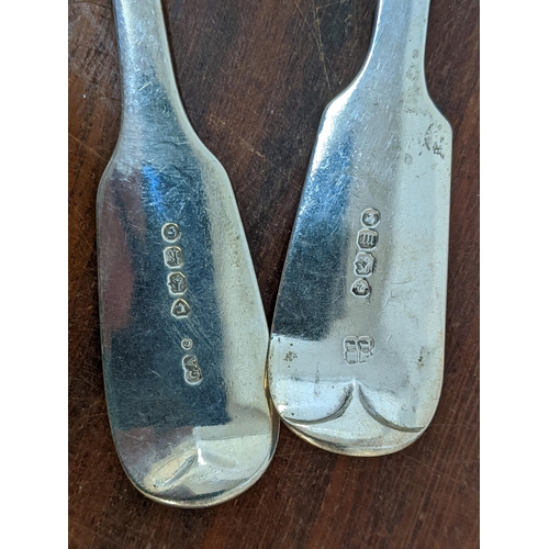 156 - Two Victorian silver fiddle pattern sauce ladles, one with a crest the other initialled, 142g
Locati... 