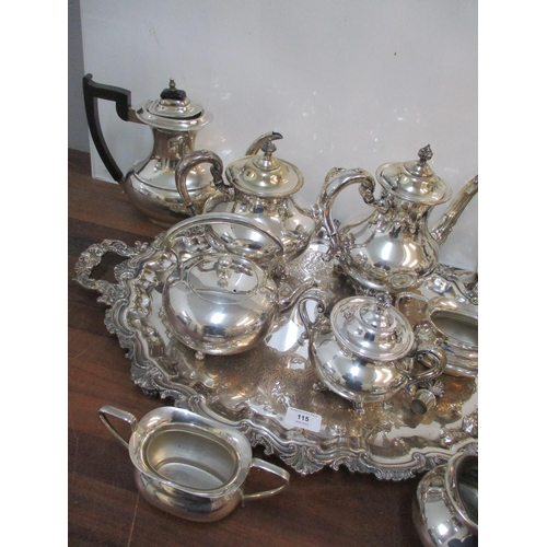 115 - A selection of silver plate to include an ornate twin handled tray, coffee/tea services, candlestick... 