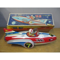 A boxed tinplate and battery operated flying saucer with