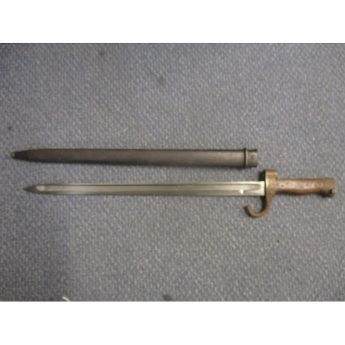99 - A French model 1892 bayonet fullered blade stamped JC to base quillon No 17549 with metal scabbard b... 