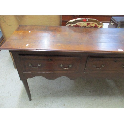 117 - A mid 18th century oak sideboard having three drawers above carved shaped frieze 87cm h x 196cm w
Lo... 