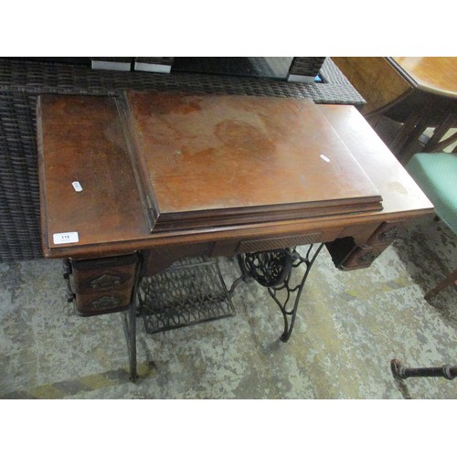 118 - A late 19th/early 20th century walnut and wrought iron Singer sewing treadle machine table 79cm h x ... 