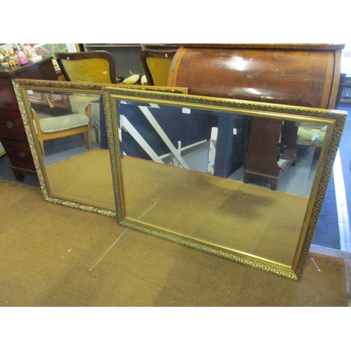 77 - Two modern gold farmed wall mirrors with bevelled glass
Location: RWM