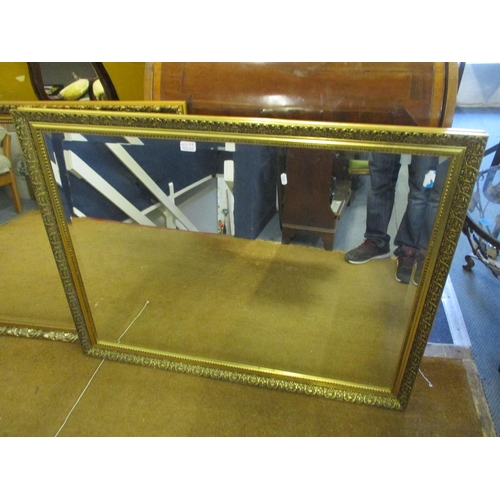 77 - Two modern gold farmed wall mirrors with bevelled glass
Location: RWM