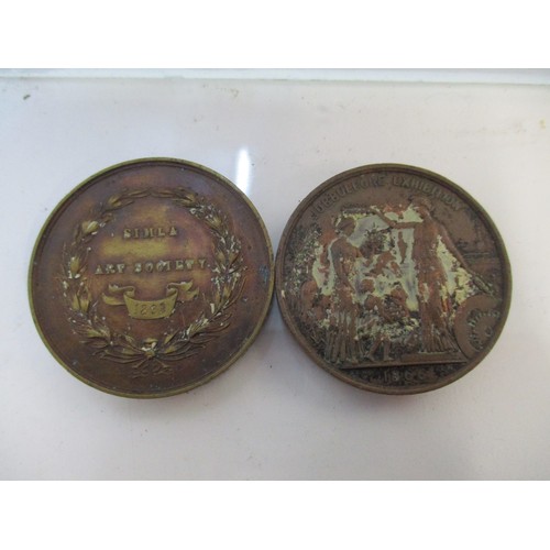 67 - Two Victorian India bronze medals to include a Jubbulpore Exhibition 1866 bronze medal obverse showi... 