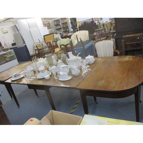404 - A Georgian mahogany drop flap D-end dining table on square tapering legs, brass cup and castors 73cm... 