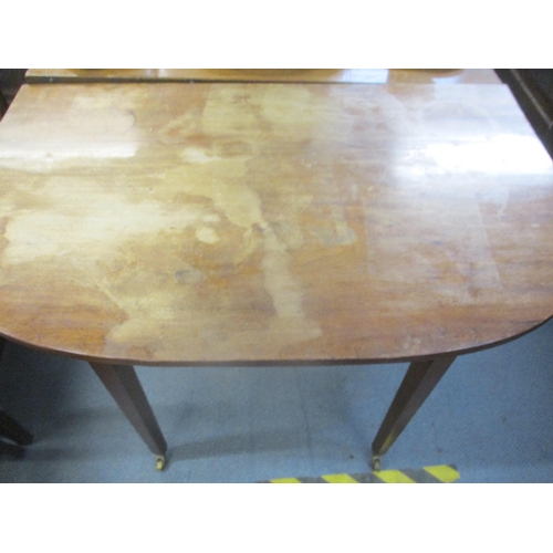 404 - A Georgian mahogany drop flap D-end dining table on square tapering legs, brass cup and castors 73cm... 