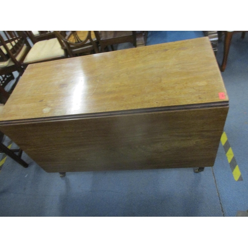 404 - A Georgian mahogany drop flap D-end dining table on square tapering legs, brass cup and castors 73cm... 