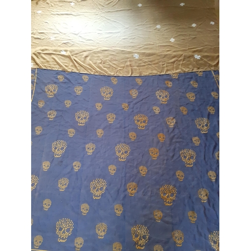 10 - Alexander McQueen-A blue silk shawl having images of skulls and the designer's name together with a ... 