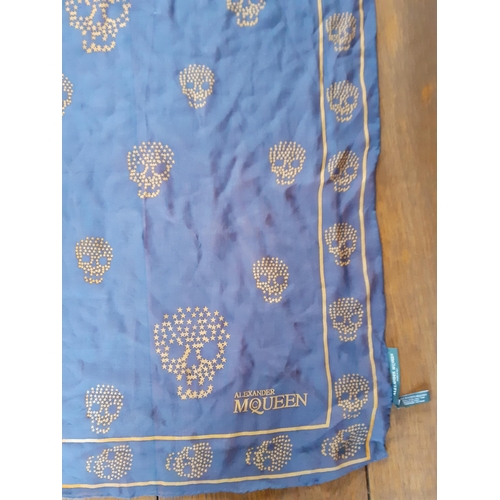 10 - Alexander McQueen-A blue silk shawl having images of skulls and the designer's name together with a ... 