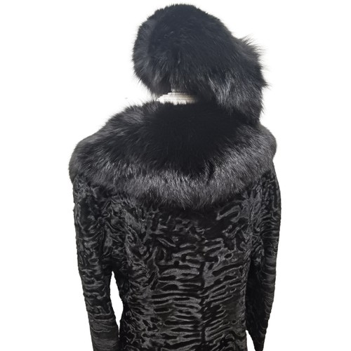 39 - An Alan Fischelis black shearling and rabbit hair three-quarter length coat, UK size 10/12 having an... 