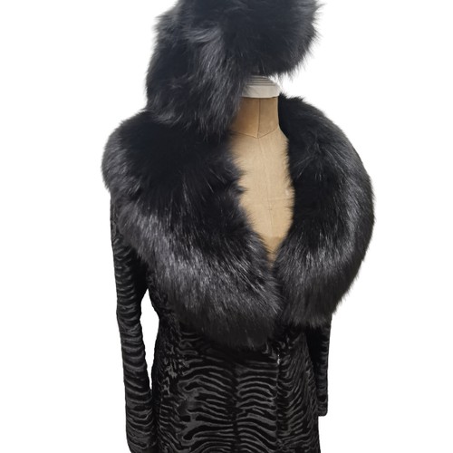 39 - An Alan Fischelis black shearling and rabbit hair three-quarter length coat, UK size 10/12 having an... 