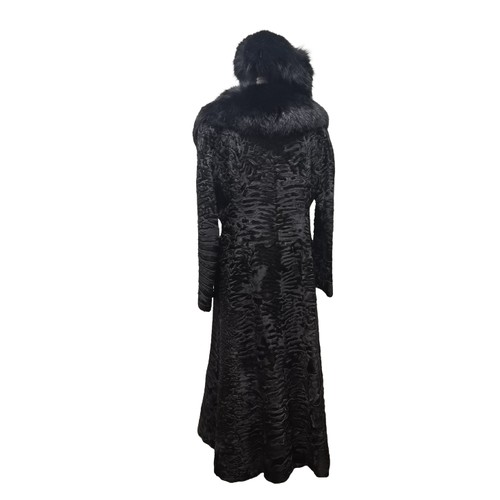39 - An Alan Fischelis black shearling and rabbit hair three-quarter length coat, UK size 10/12 having an... 