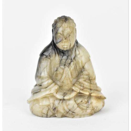 174 - A Chinese Qianlong period carved chicken bone jade figure of Budha Shakamuni in seated lotus positio... 