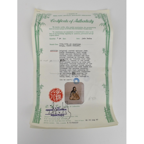 174 - A Chinese Qianlong period carved chicken bone jade figure of Budha Shakamuni in seated lotus positio... 