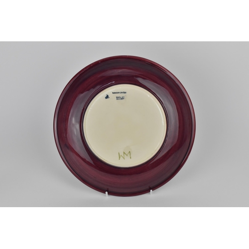 126 - A Moorcroft ceramic Pansy plate designed by Rachel Bishop, with impressed marks and signature to the... 