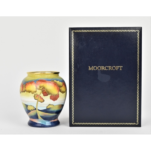 128 - A limited edition Moorcroft Enamels Ltd miniature baluster vase in the 'Hazledene Sunset' pattern by... 