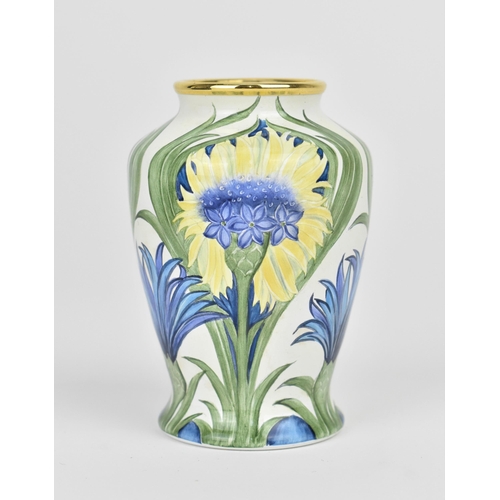 129 - A limited edition Moorcroft Enamels Ltd miniature vase in the cornflower pattern, florian ware style... 