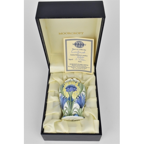 129 - A limited edition Moorcroft Enamels Ltd miniature vase in the cornflower pattern, florian ware style... 