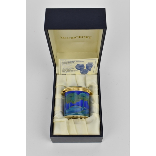 130 - A Moorcroft Enamels Ltd miniature box with hinged lid, decorated in the ‘Moonlit Blue’ pattern, in o... 
