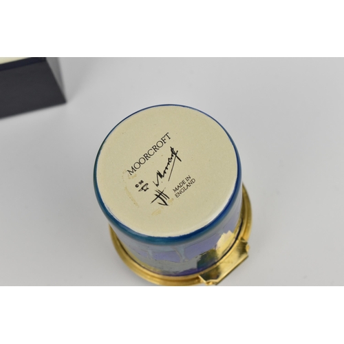 130 - A Moorcroft Enamels Ltd miniature box with hinged lid, decorated in the ‘Moonlit Blue’ pattern, in o... 