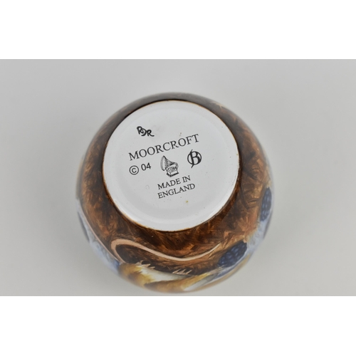 133 - A Moorcroft Enamels Ltd miniature vase, of squat form designed with dormice eating blackberries, art... 