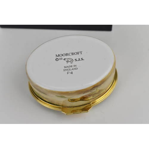 135 - A Moorcroft Enamels Ltd box with hinged cover, by Stephen Smith, painted by Faye Williams depicting ... 