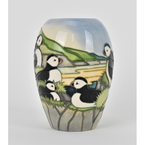 141 - A Moorcroft ceramic baluster vase in the 'Puffin' pattern designed by Carol Lovett, 1997, with impre... 